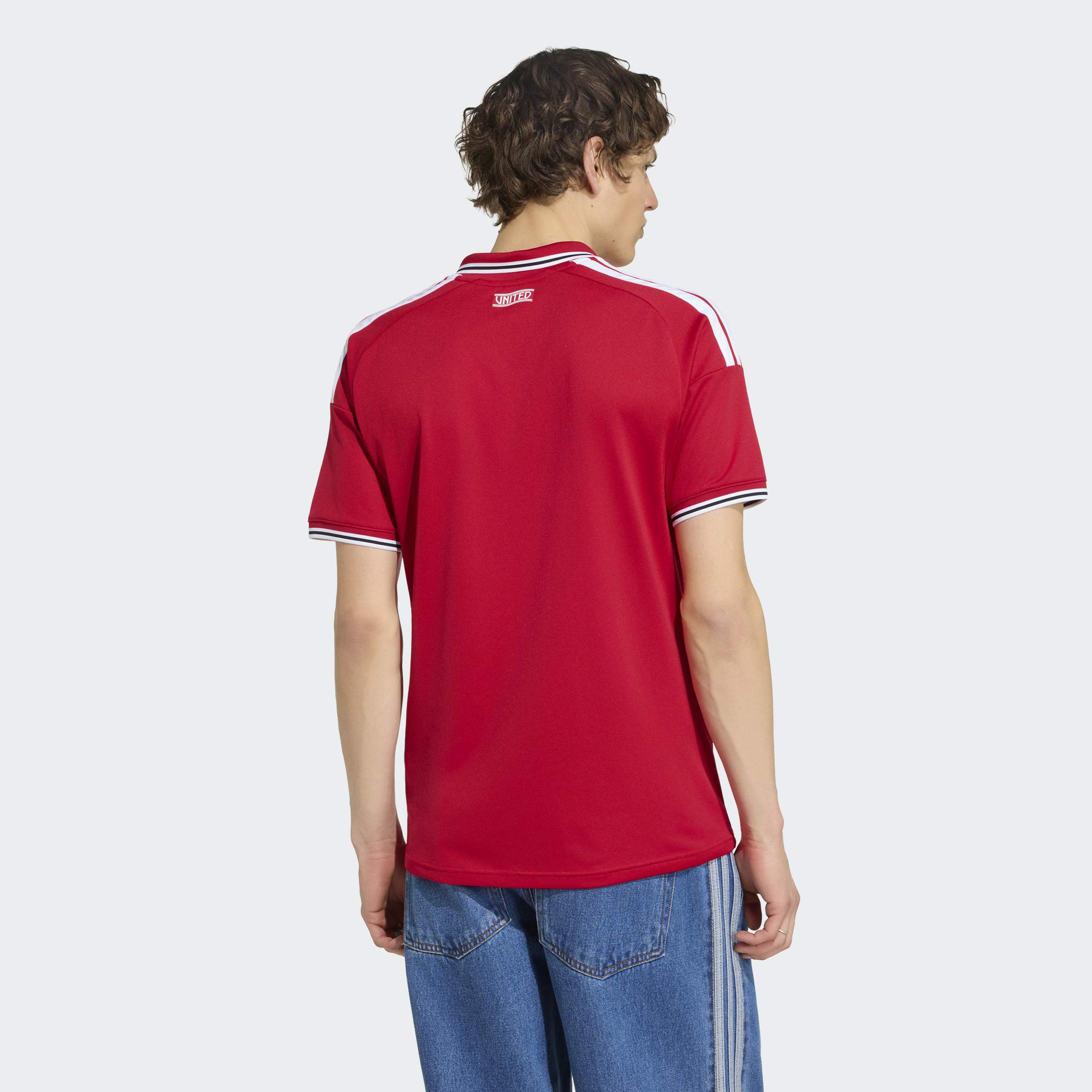 manchester united 2026/27 home shirt cropped, red and white, back view on model